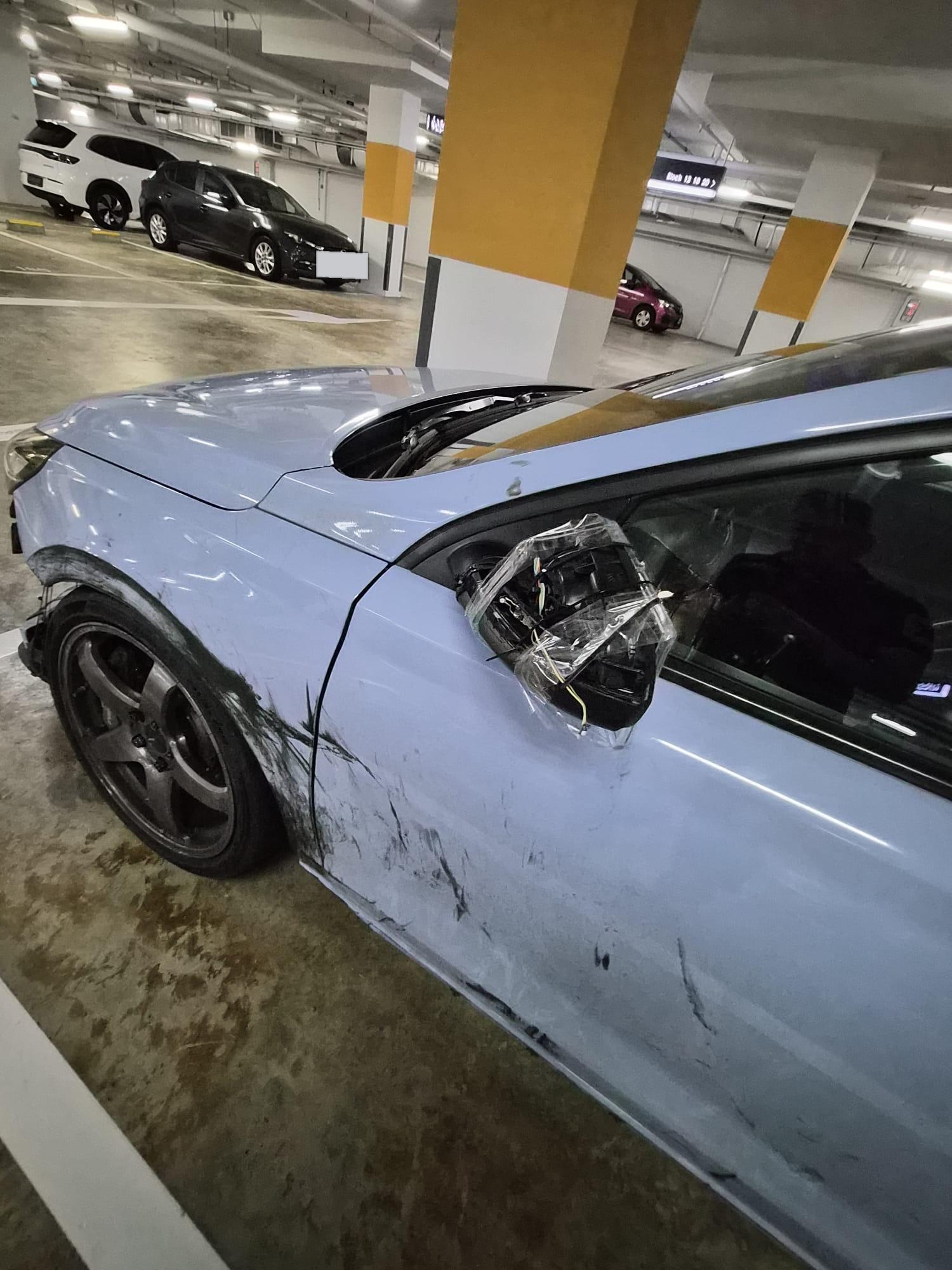 Left fender and door scraped, door mirror torn off and wrapped in cling film
