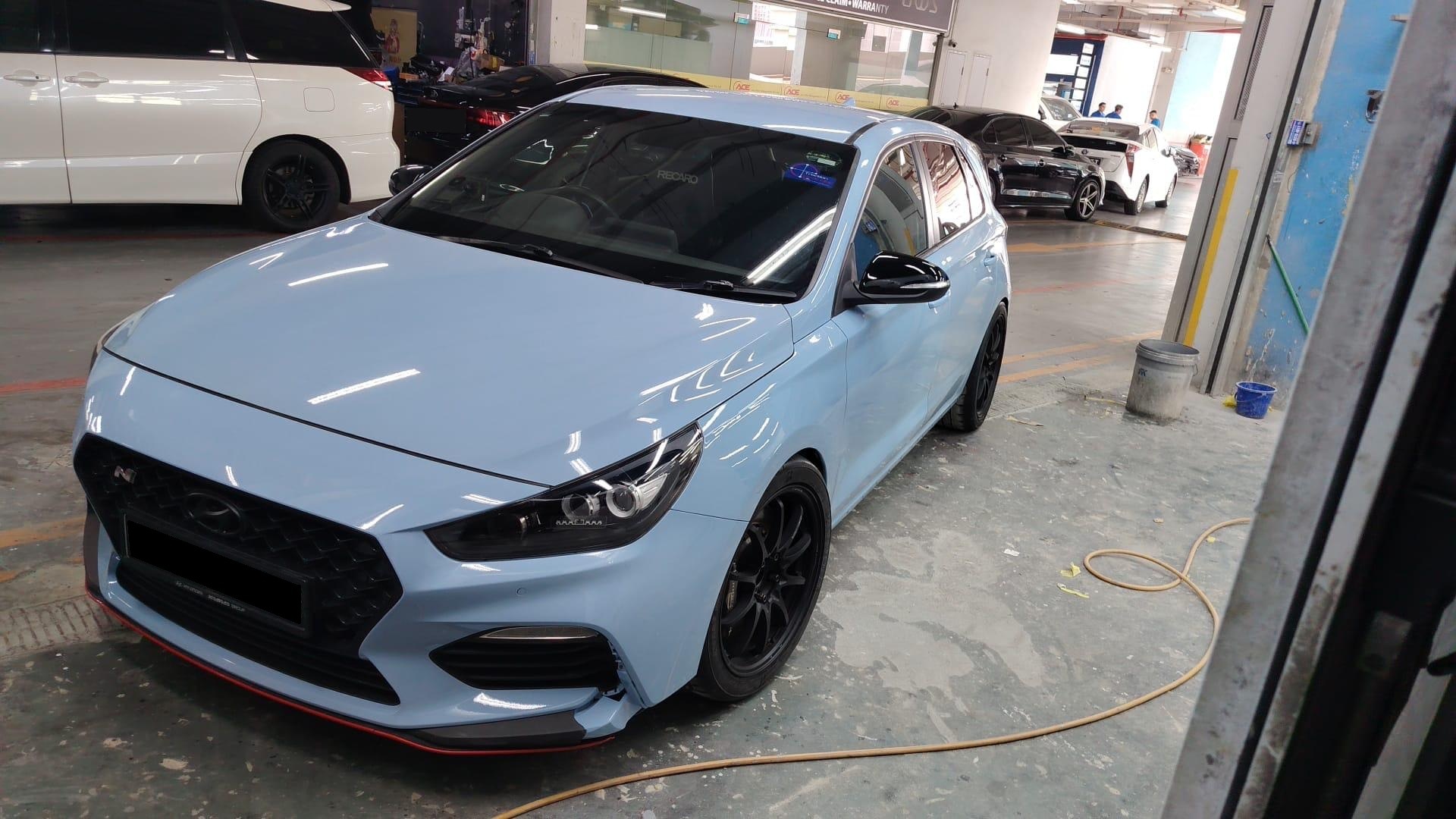 Front three-quarter out of the booth — panels straight, mirror back on, plate obscured