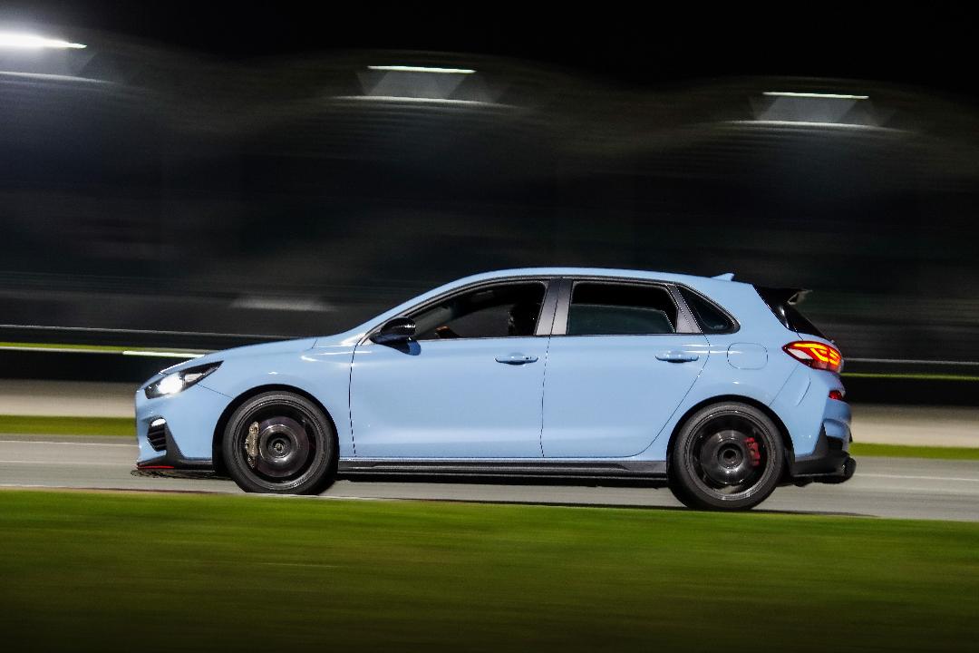 Side profile, motion-panned at night