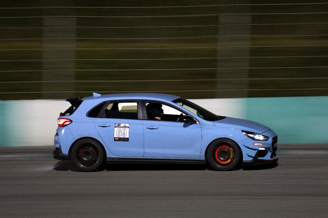 Dusk panning shot — #69 MOTUL livery
